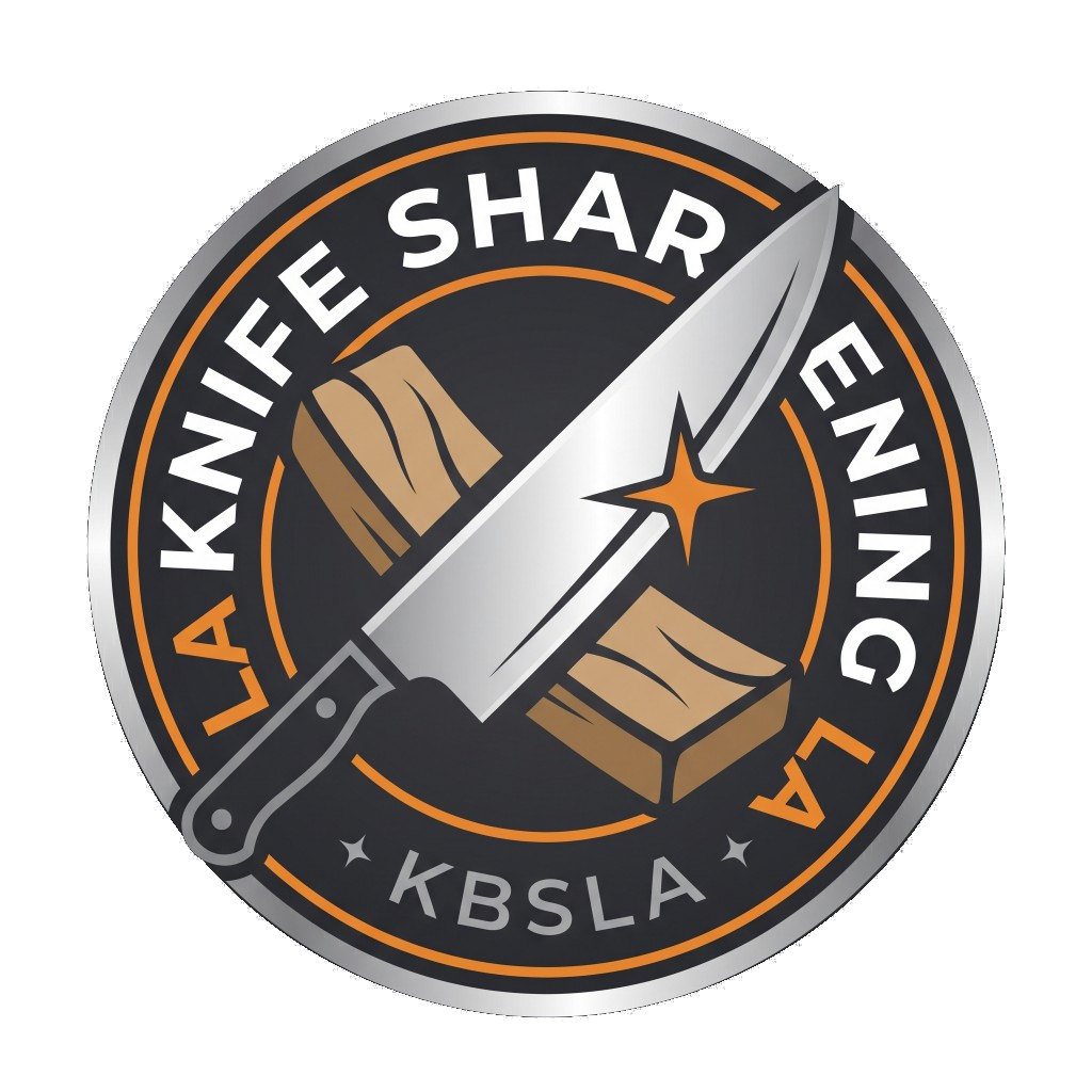 A circular logo for “LA Knife Sharpening” features a large chef’s knife resting diagonally across a wooden block. The design uses a black, orange, and metallic silver color scheme, with the text “KBSLA” at the bottom and a small orange star icon on the knife blade.